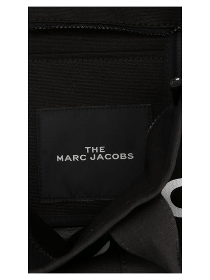 Large Shopper Tote Bag by Marc Jacobs for women in cotton canvas bicolour, black, white & print features an metropolitan chic Cotton Canvas Large Shopper Tote Bag design with a secure zipper, metropolitan chic , and versatile handle for a metropolitan chic look.
