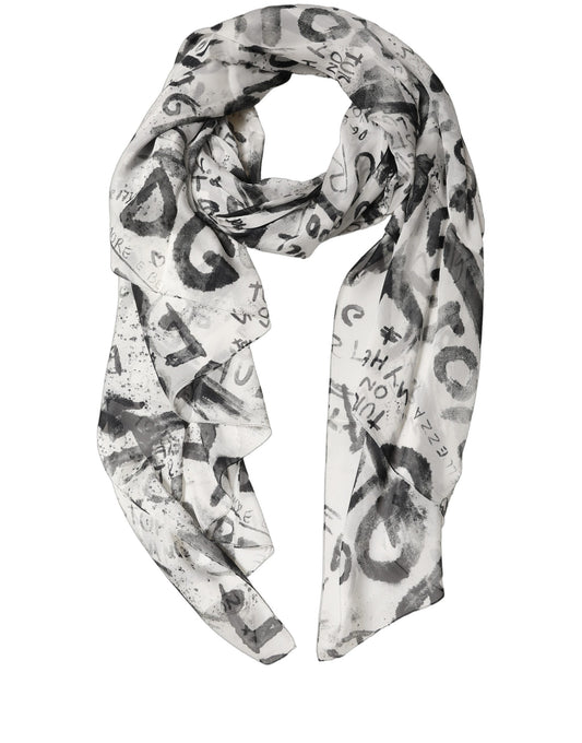 Scarf by Dolce & Gabbana for women in silk black, white, signature & print showcases a warm silhouette from the Silk Rectangular Stole Scarf collection, offering a warm drape that exudes sophisticated luxury.