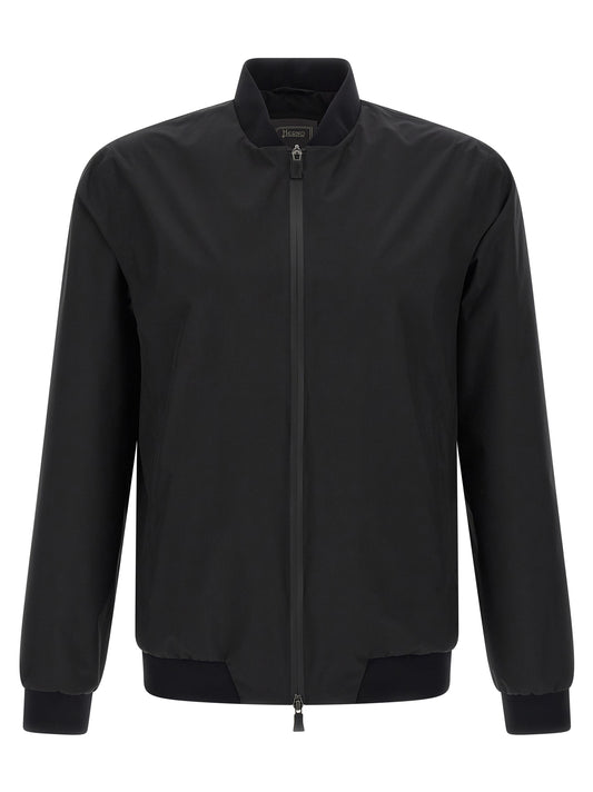This Bomber Jacket by Herno for men in polyester black exhibits a edgy silhouette, meticulously detailed with functional breathable-design & pockets and a edgy high-neck neckline for a edgy finish.