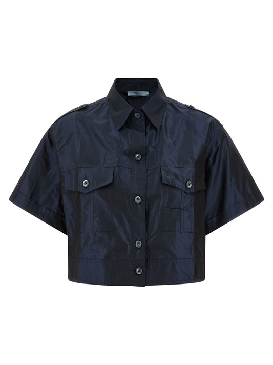 Blouse by Prada for women in silk blue presents a discerning silhouette, showcasing a sophisticated and short-sleeve for a truly discerning finish.