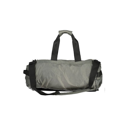 Travel Duffel Bag by K-WAY for men in polyamide green presents a fashionable Nomad Polyamide Travel Duffel Bag design, showcasing a secure zipper and fashionable external-pockets & internal-pockets with versatile adjustable-strap & handle.