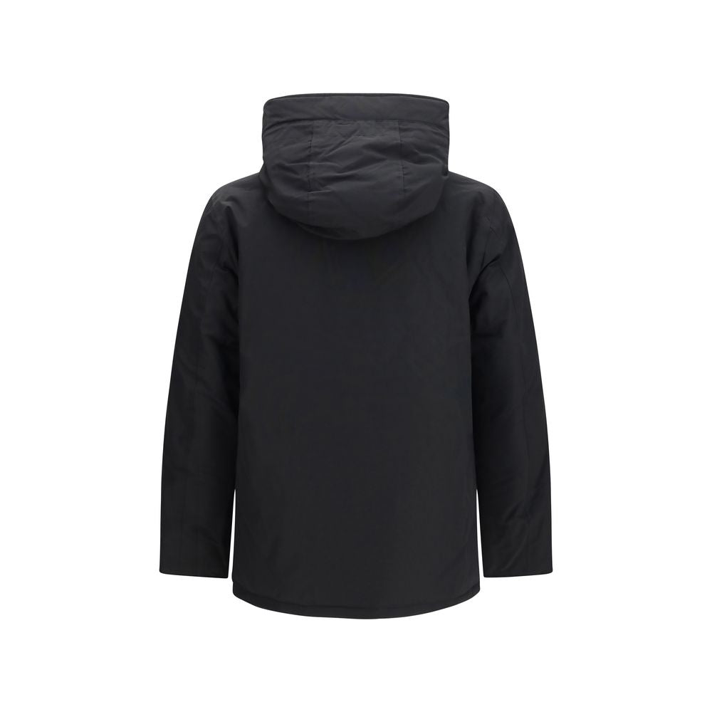 Hooded Puffer Jacket by Woolrich for men in cotton polyamide & duck down black, chevron & signature features a city-ready silhouette, detailed with insulated, pockets, hooded & windproof and a city-ready hooded neckline.