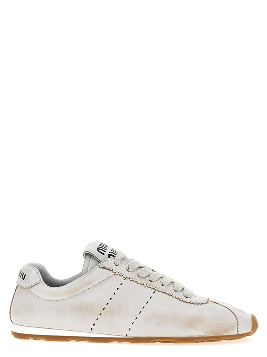 Sneakers by Miu Miu for women in nappa calfskin leather white presents a sumptuous silhouette, artfully capturing the essence of the Women's Low Top Nappa Calfskin Leather Sneakers with its sumptuous low-top style design.
