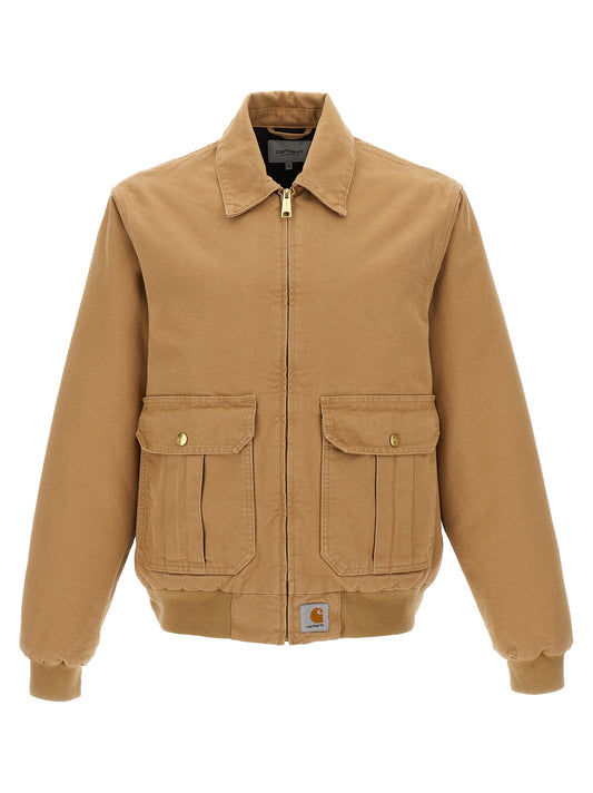 Overcoat by Carhartt Wip for men in cotton canvas beige & signature showcases a enveloping silhouette, detailed with distinctive pockets and a enveloping shirt-collar neckline.