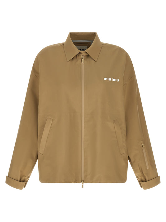 Windbreaker Jacket by Miu Miu for women in polyester canvas beige features an magnificent silhouette, showcasing the sophisticated shirt-collar neckline and functional pockets & windproof for a premium, magnificent look.