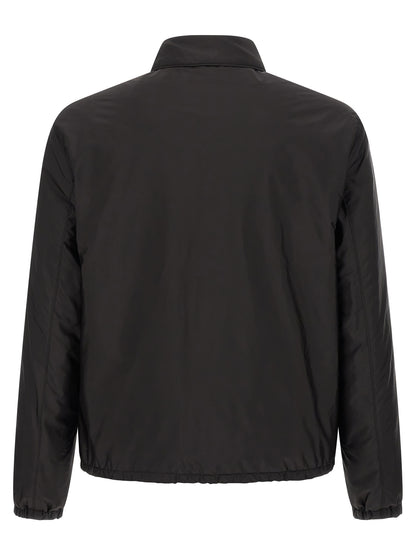 Overcoat by Prada for men in nylon black showcases a enveloping silhouette, detailed with distinctive pockets and a enveloping shirt-collar neckline.