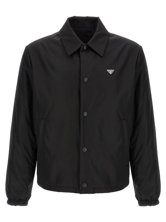 Windbreaker Jacket by Prada for men in nylon black presents a resilient silhouette, artfully detailed with a sophisticated shirt-collar neckline and functional pockets, insulated & windproof for a resilient finish.