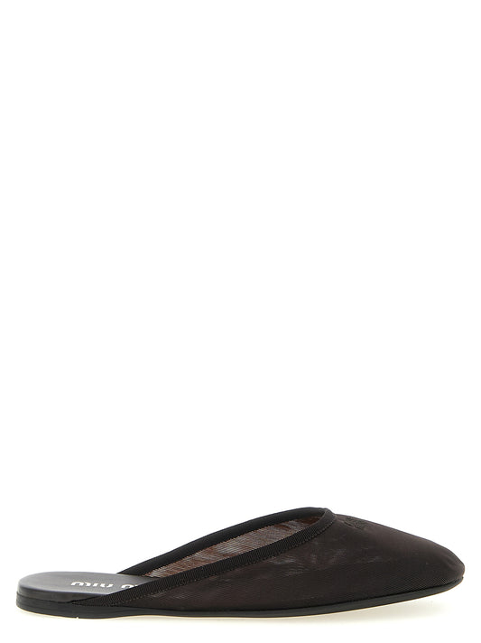 Slippers Flat Shoes by Miu Miu for women in polyester leather black & transparent presents a impeccable silhouette as Women's Polyester Leather Slippers Flat Shoes, artfully designed with a and a impeccable round toe style for a refined, upscale finish.
