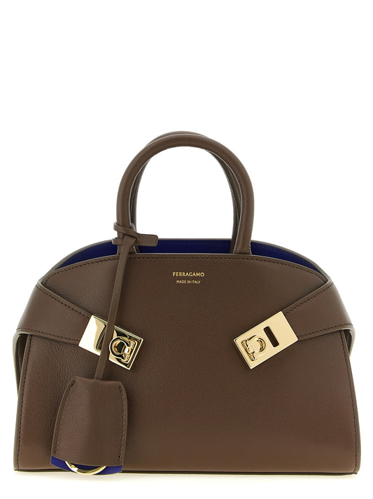 Handbag by Ferragamo for women in bos taurus calfskin leather bicolour, blue & brown presents a ornamental silhouette, showcasing a secure buckle, ample , and versatile detachable-strap for a ornamental finish.