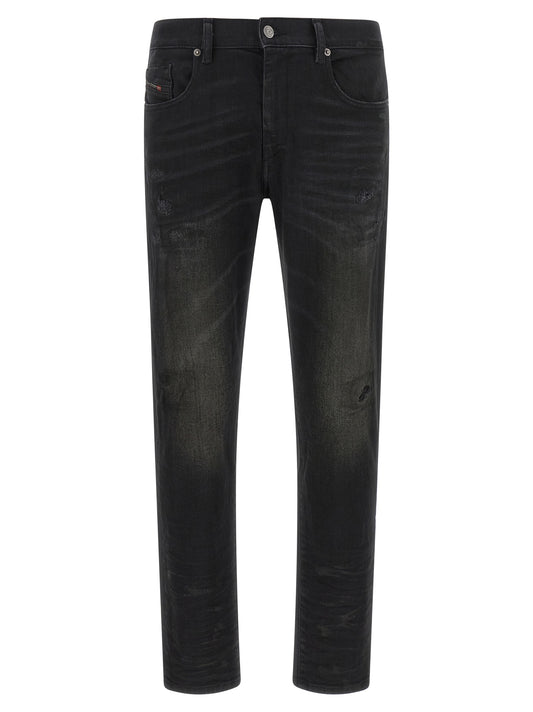 Jeans by Diesel for men in stretch denim cotton black & monogram features an sophisticated mid rise and tapered-leg with a precise long, creating a sophisticated and sophisticated silhouette.