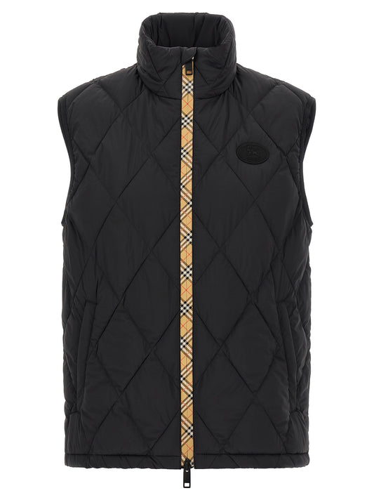 Vest by Burberry for men in nylon & silicone black showcases a utilitarian silhouette, artfully incorporating lightweight & insulated and a utilitarian for a truly utilitarian finish.