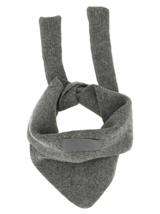 Scarf by Jacquemus for women in alpaca wool & polyamide gray presents a cosy silhouette, artfully capturing the sophisticated design and premium aesthetic of the Essence Alpaca Wool & Polyamide Wrap Triangular Scarf.
