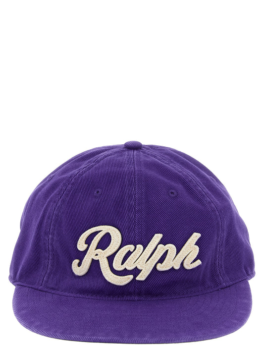 This Baseball Cap by Polo Ralph Lauren for men in cotton twill & leather brown, peach, purple & herringbone presents a distinguished silhouette, meticulously showcasing the signature aesthetic and high-end profile of the Cotton Twill & Leather Baseball Cap.