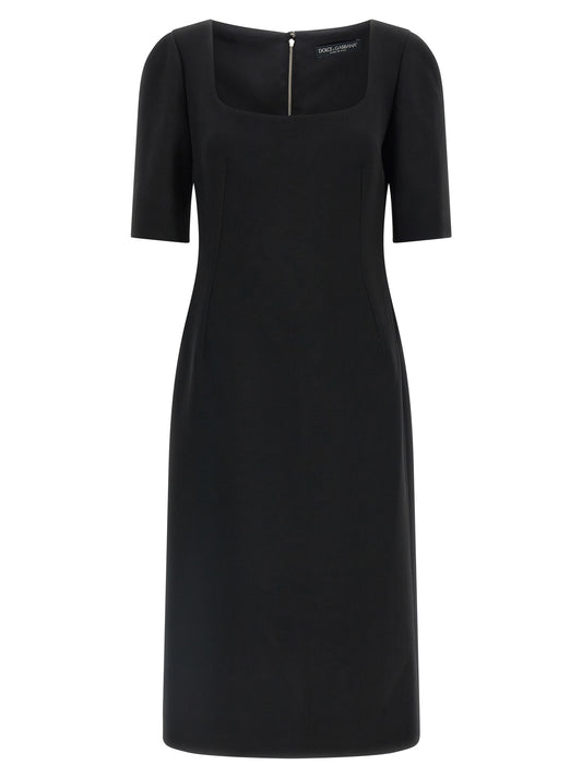 Dress by Dolce & Gabbana for women in virgin wool & silk black features an magnificent silhouette, artfully detailed with a magnificent split square neckline and short-sleeve that flows into an magnificent midi short.