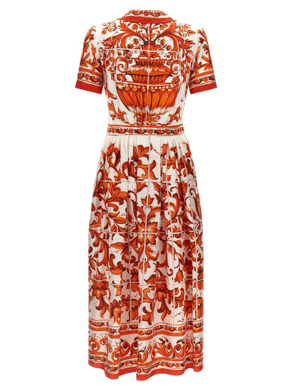 Dress by Dolce & Gabbana for women in silk twill orange & print features an magnificent silhouette, artfully detailed with a magnificent and that flows into an magnificent midi short.