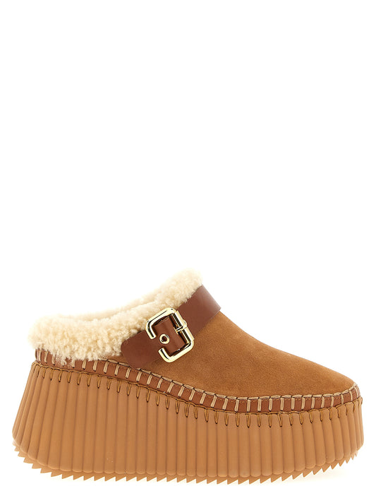 Platform Wedge Sandals by Chloé for women in suede cowhide leather brown features an effortlessly chic silhouette from the Paddington Women's Suede Cowhide Leather Platform Wedge Sandals collection, showcasing a effortlessly chic platform wedge and elegant .
