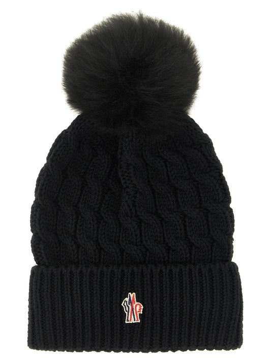 Beanie Hat by Moncler Grenoble for women in virgin wool black presents a urban-chic silhouette, showcasing the urban-chic craftsmanship of this Virgin Wool Beanie Hat.