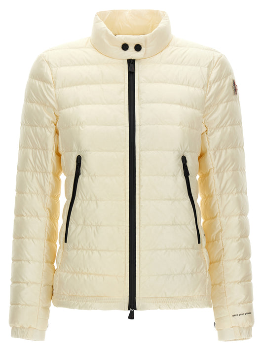 This Puffer Jacket by Moncler Grenoble for women in stretch polyamide cream, white, signature & print exhibits a edgy silhouette, meticulously detailed with functional insulated and a edgy high-neck neckline for a edgy finish.