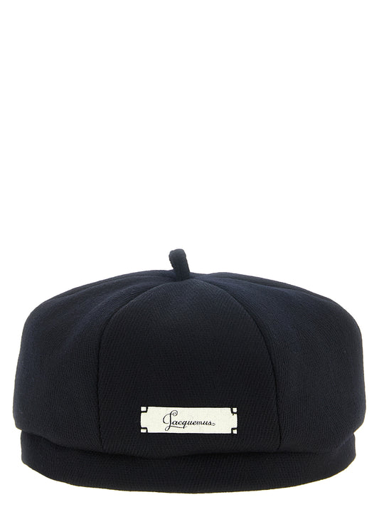 Beret by Jacquemus for women in virgin wool navy features a refined luxury silhouette, artfully capturing the essence of the refined luxury Virgin Wool Beret design for a sophisticated, premium look.