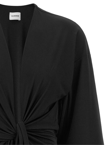 Dress by The Andamane for women in stretch polyester black features an eye catching silhouette with a sophisticated v-neck neckline, elegant , and a refined short mini for a eye catching aesthetic.