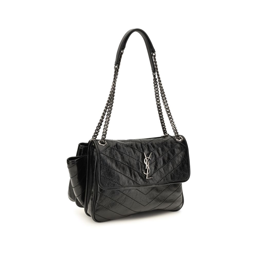 Shoulder Flap Bag by Saint Laurent for women in bos taurus calf leather black, chevron, signature & monogram features an effortlessly chic silhouette with a secure flap & magnetic, ample , and versatile shoulder-strap for effortlessly chic everyday luxury.