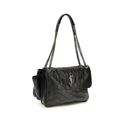 Shoulder Flap Bag by Saint Laurent for women in bos taurus calf leather black, chevron, signature & monogram features an effortlessly chic silhouette with a secure flap & magnetic, ample , and versatile shoulder-strap for effortlessly chic everyday luxury.
