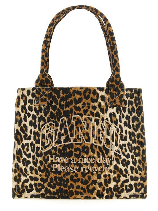 This Large Tote Bag by Ganni for women in cotton black, brown, leopard-print & print features an on trend Cotton Large Tote Bag design with a secure zipper, ample , and on trend handle.