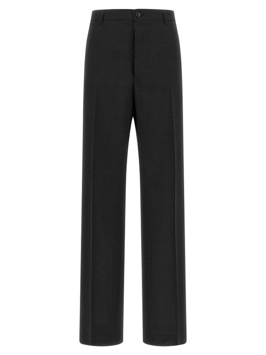 Trousers by Maison Margiela for women in wool dark-gray & gray features a sculptural silhouette, showcasing a sculptural straight-leg & wide and long with a sophisticated high rise for a sculptural finish.