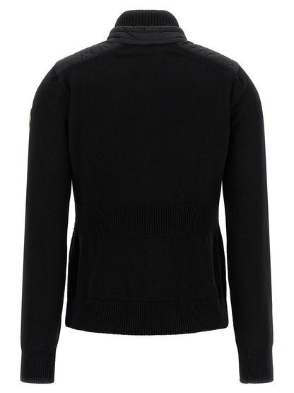 Cardigan by Moncler Grenoble for women in polyamide & virgin wool black showcases a captivating silhouette, artfully detailed with a captivating and high-neck neckline for a truly sophisticated captivating look.