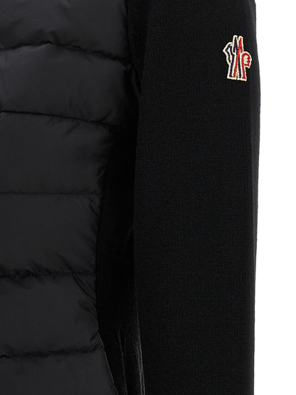 Cardigan by Moncler Grenoble for women in polyamide & virgin wool black showcases a captivating silhouette, artfully detailed with a captivating and for a truly sophisticated captivating look.