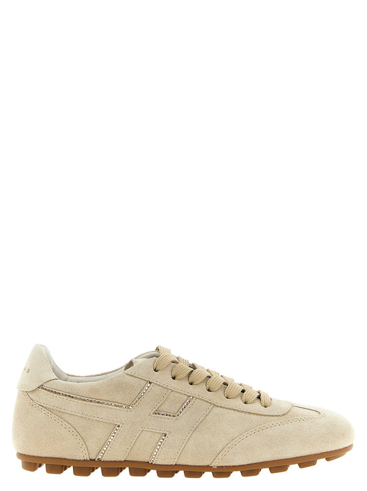 Athletic Sneakers by Hogan for women in suede goat & calfskin leather beige showcases a architectural silhouette, artfully capturing the essence of the Women's Low Top Suede Goat & Calfskin Leather Athletic Sneakers with its signature architectural low-top style construction.