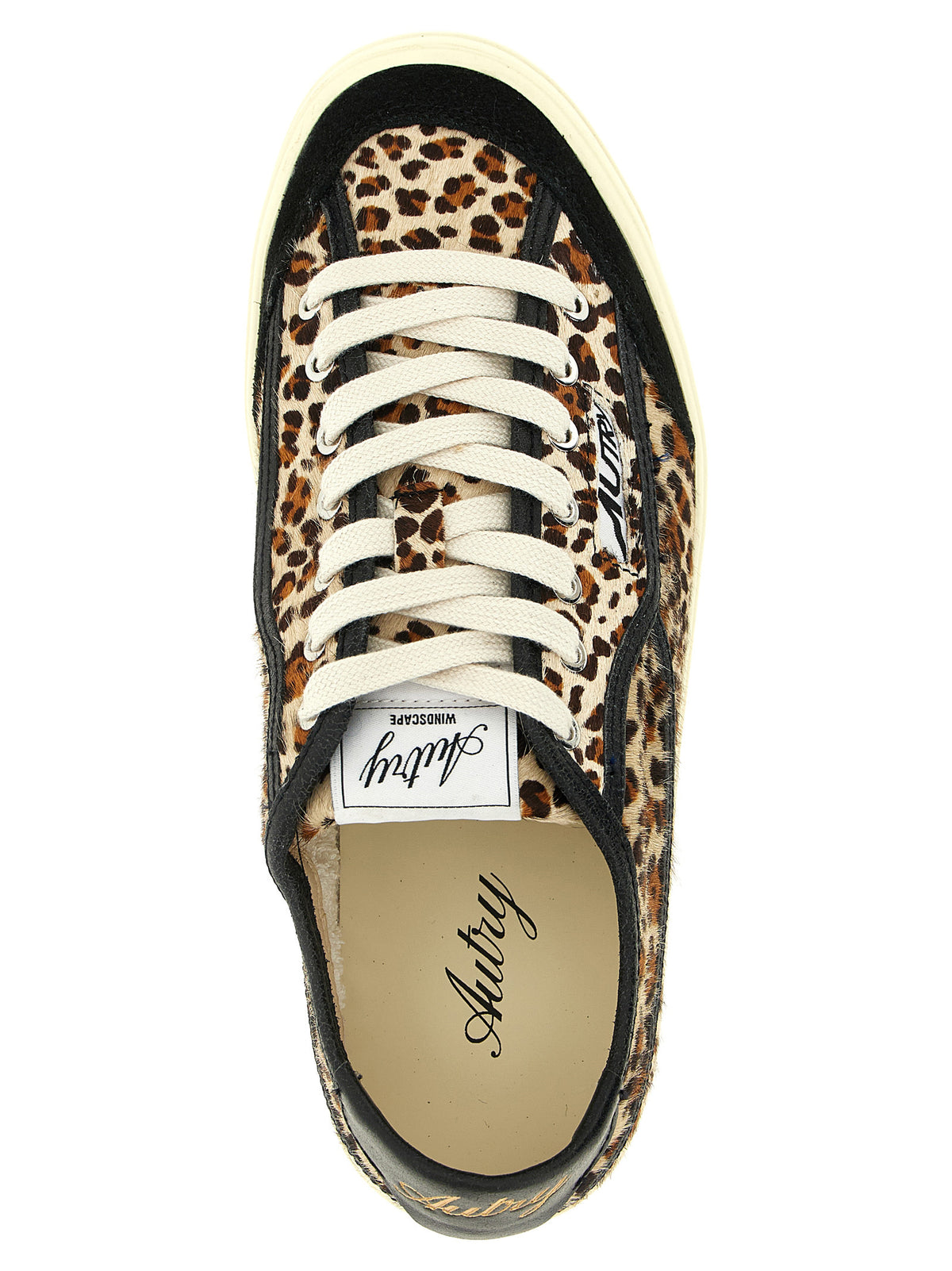Sneakers by Autry for women in cotton & bos taurus suede cowhide leather black, brown, gold, leopard-print, signature & print presents a sumptuous silhouette, artfully capturing the essence of the Pony Women's Low Top Cotton & Bos Taurus Suede Cowhide Leather Sneakers with its sumptuous low-top style design.