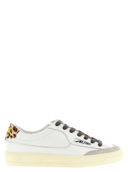 Sneakers by Autry for women in cowhide suede leather animal, cream, gray, multicolor, white & print features a chic design, perfectly showcasing the chic low-top style of this Pony Women's Low Top Cowhide Suede Leather Sneakers.