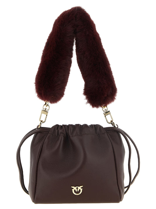 Shoulder Bucket Bag by PINKO for women in lambskin leather cotton & fur bordeaux & gold showcases a enviable silhouette, artfully detailed with a secure zipper, organized , and versatile shoulder-strap, detachable-strap & handle for a enviable look.
