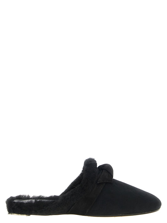 Mules Flat Shoes by Alexandre Birman for women in plush suede calfskin leather black presents a effortless chic silhouette, showcasing the Women's Plush Suede Calfskin Leather Mules Flat Shoes design with a effortless chic and for a sophisticated look.