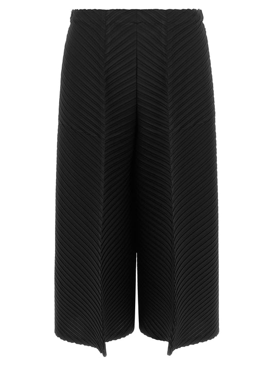 Trousers by Issey Miyake for women in polyester black, patterned & herringbone features an on trend silhouette, showcasing a sophisticated wide & cropped with a cropped and for an on trend finish.