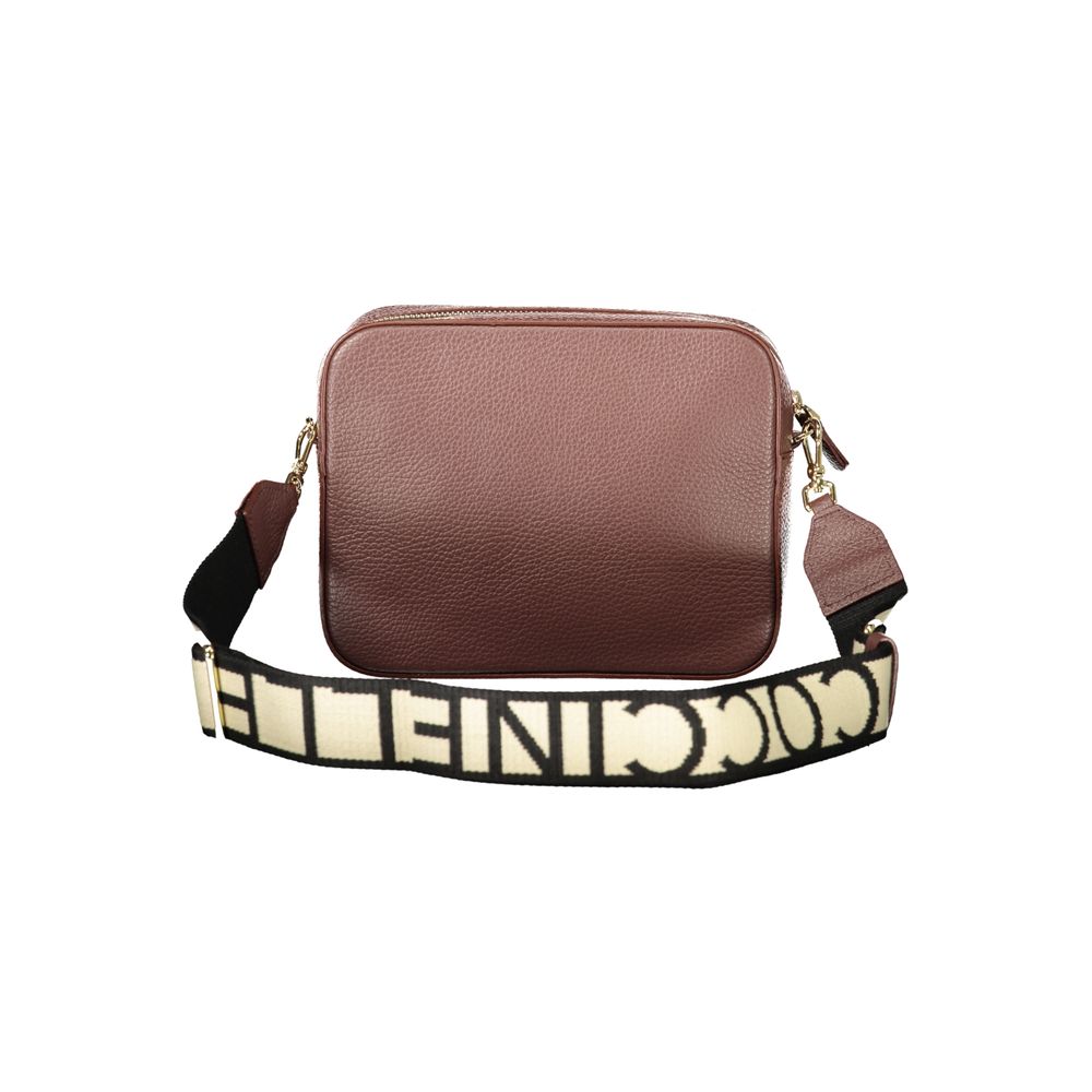 Handbag by Coccinelle for women in leather brown presents a ornamental silhouette, showcasing a secure zipper, ample , and versatile shoulder-strap & adjustable-strap for a ornamental finish.