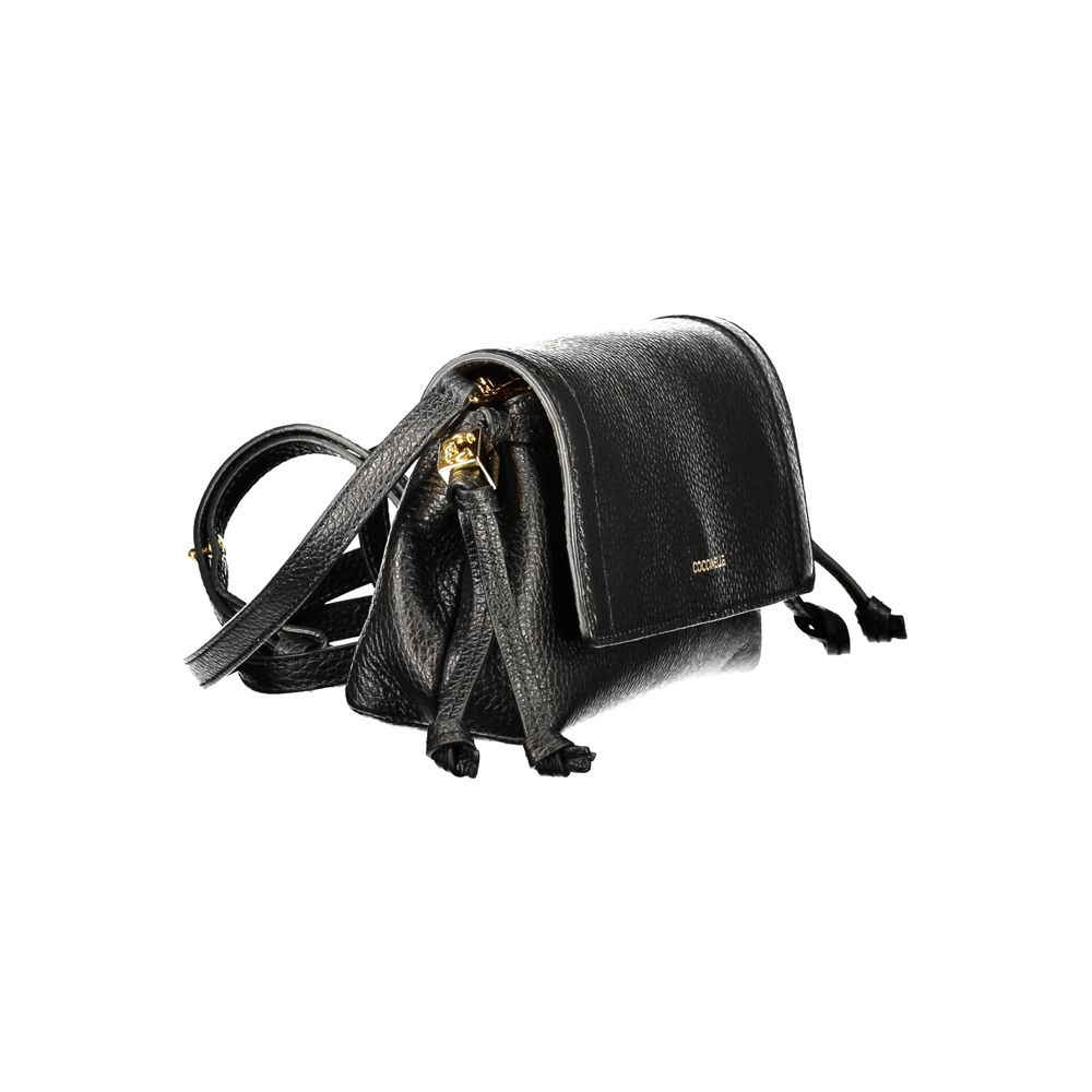 Handbag by Coccinelle for women in leather black features an refined silhouette, showcasing a secure snap, ample document-holder & internal-pockets, and versatile shoulder-strap & adjustable-strap for a sophisticated refined aesthetic.