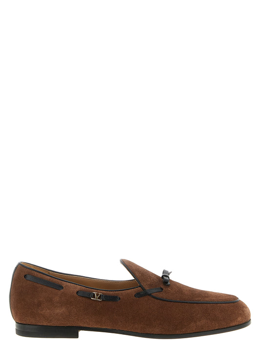 Loafer Slip-On Shoes by Valentino Garavani for men in calfskin leather black, brown, gold & signature features an dynamic silhouette from the V Logo Men's Calfskin Leather Loafer Slip-On Shoes collection, defined by a dynamic and for a dynamic look.