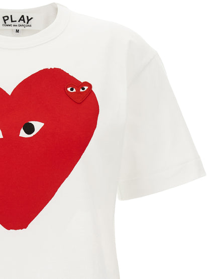T-Shirt by Comme Des Garçons Play for women in cotton red, white & print showcases a fashionable silhouette, elegantly detailed with a fashionable and crew neckline for a sophisticated, high-fashion look.