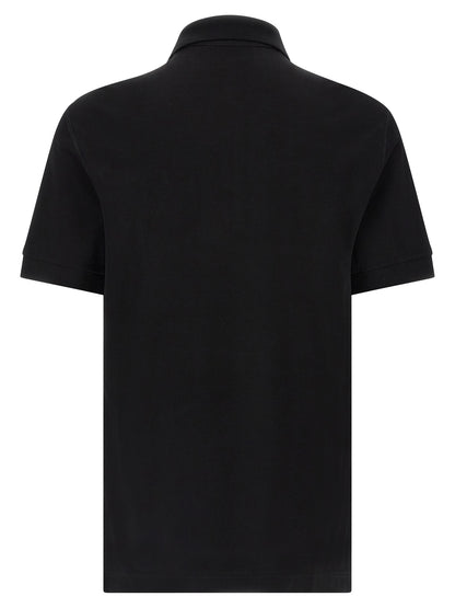 Polo Shirt by Dolce & Gabbana for men in cotton black presents a sleek silhouette, featuring a refined and for a sleek finish.