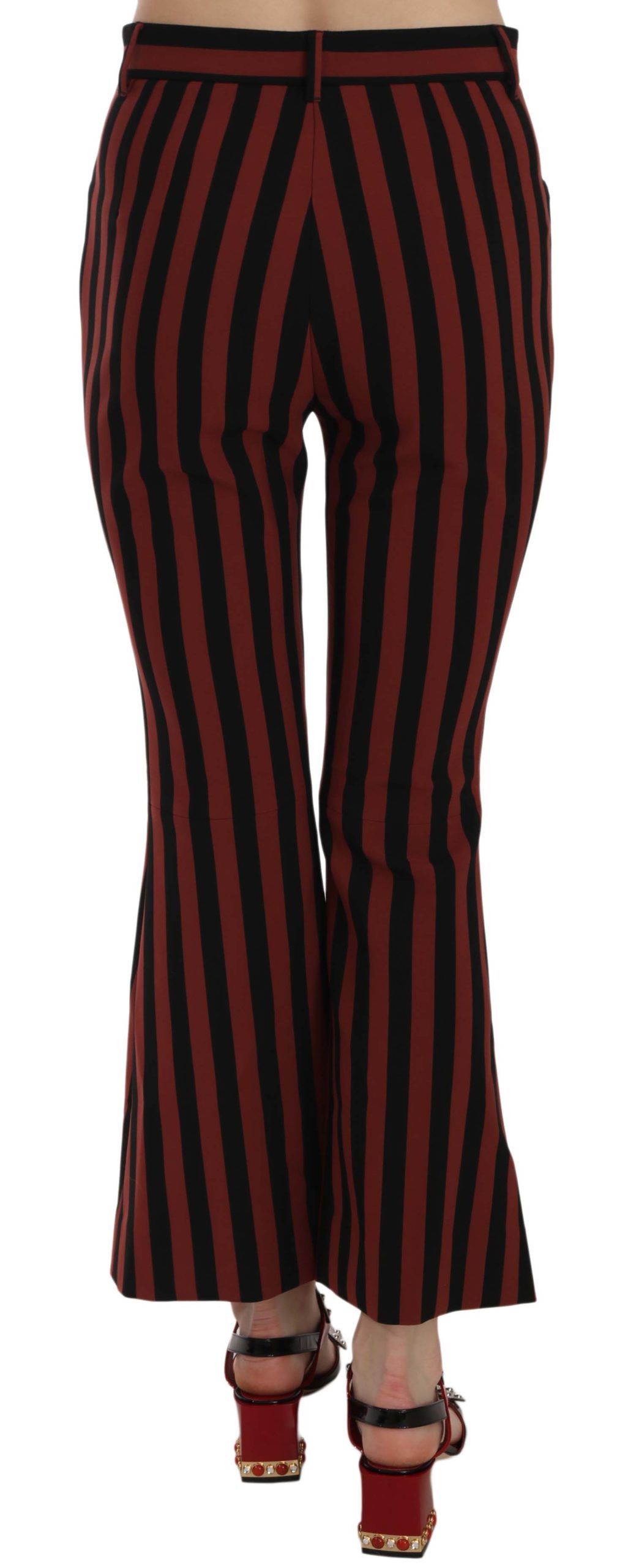 Trousers by Dolce & Gabbana for women in stretch polyester & rayon black, red & striped presents a perennial silhouette, meticulously tailored with a flared & cropped cut, cropped finish, and an elegant .