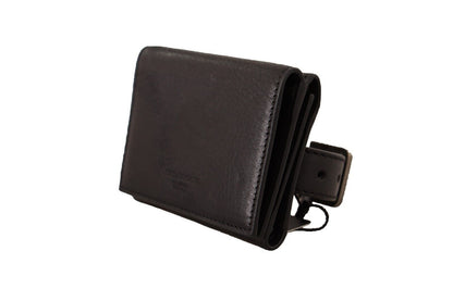 Wallet by Dolce & Gabbana for women in leather black presents a streamlined silhouette, showcasing the sophisticated design of the Leather Wallet collection with functional compact-design trifold.