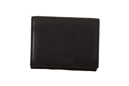 Wallet by Dolce & Gabbana for women in leather black presents a streamlined silhouette, showcasing the sophisticated design of the Leather Wallet collection with functional compact-design trifold.