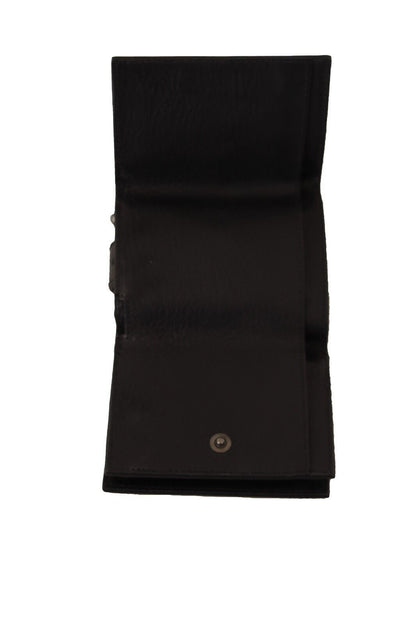 Wallet by Dolce & Gabbana for women in leather black presents a refined silhouette, artfully capturing the essence of the Leather Wallet design with sophisticated compact-design trifold for a refined look.