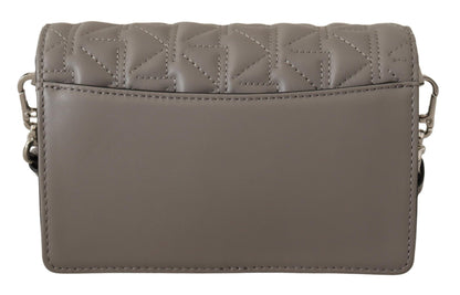 Travel Crossbody Flap Convertible Handbag by Karl Lagerfeld for women in leather gray, light-grey & silver features an exquisite silhouette, showcasing a secure snap, flap & zipper, ample built-in-compartments, and exquisite crossbody-strap, shoulder-strap & adjustable-strap for a sophisticated finish.