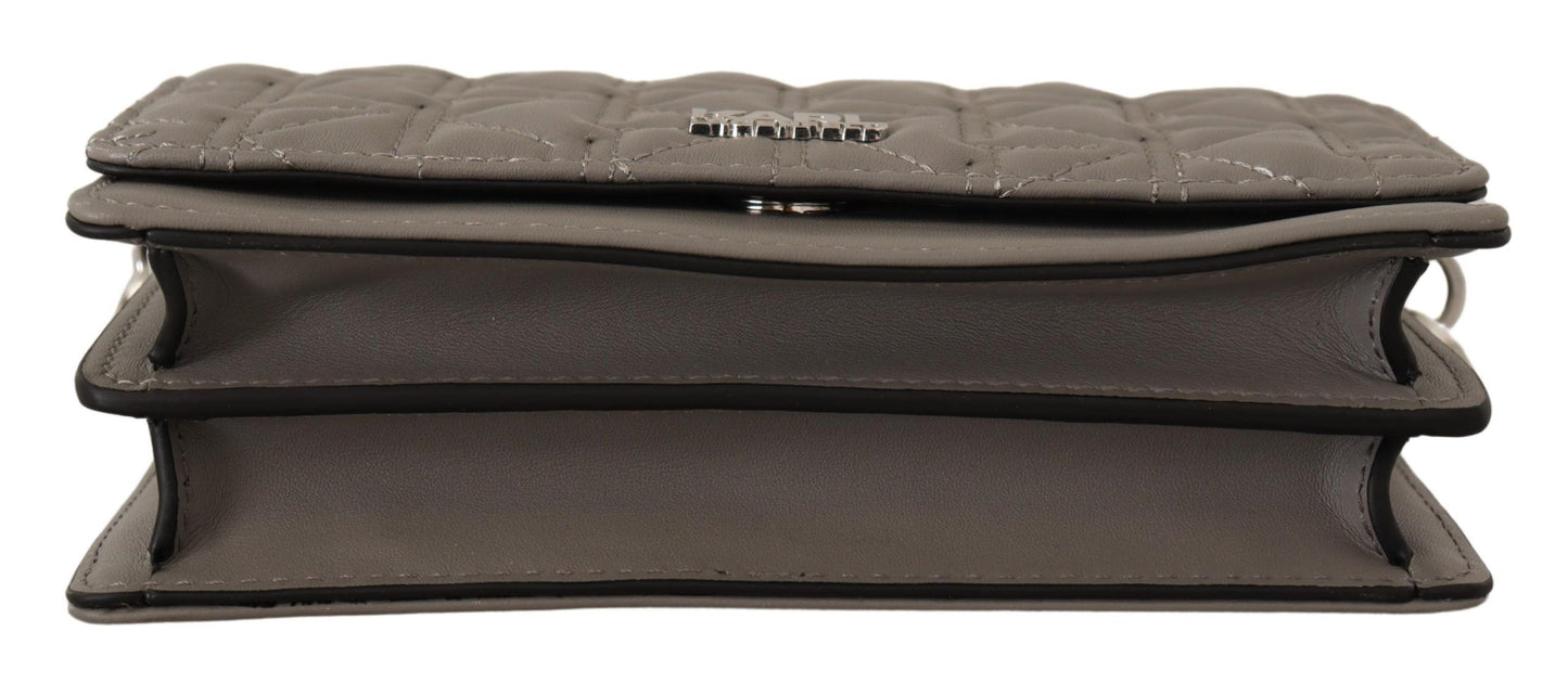 Travel Crossbody Flap Convertible Handbag by Karl Lagerfeld for women in leather gray, light-grey & silver features a exquisite silhouette with a secure snap, flap & zipper, ample built-in-compartments, and versatile crossbody-strap, shoulder-strap & adjustable-strap for a exquisite look.