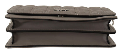 Travel Crossbody Flap Convertible Handbag by Karl Lagerfeld for women in leather gray, light-grey & silver features a exquisite silhouette with a secure snap, flap & zipper, ample built-in-compartments, and versatile crossbody-strap, shoulder-strap & adjustable-strap for a exquisite look.