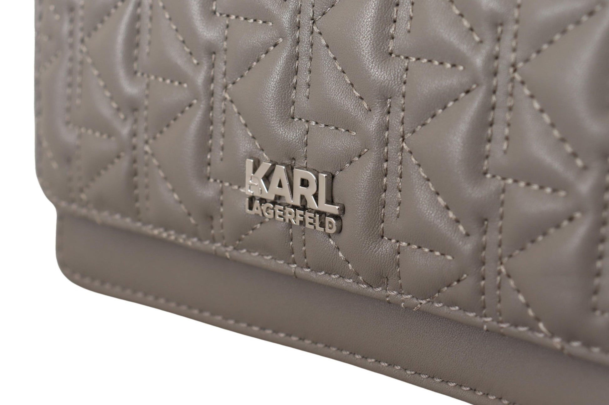 Travel Crossbody Flap Convertible Handbag by Karl Lagerfeld for women in leather gray, light-grey & silver presents a exquisite silhouette, showcasing a secure snap, flap & zipper and organized built-in-compartments with versatile crossbody-strap, shoulder-strap & adjustable-strap.