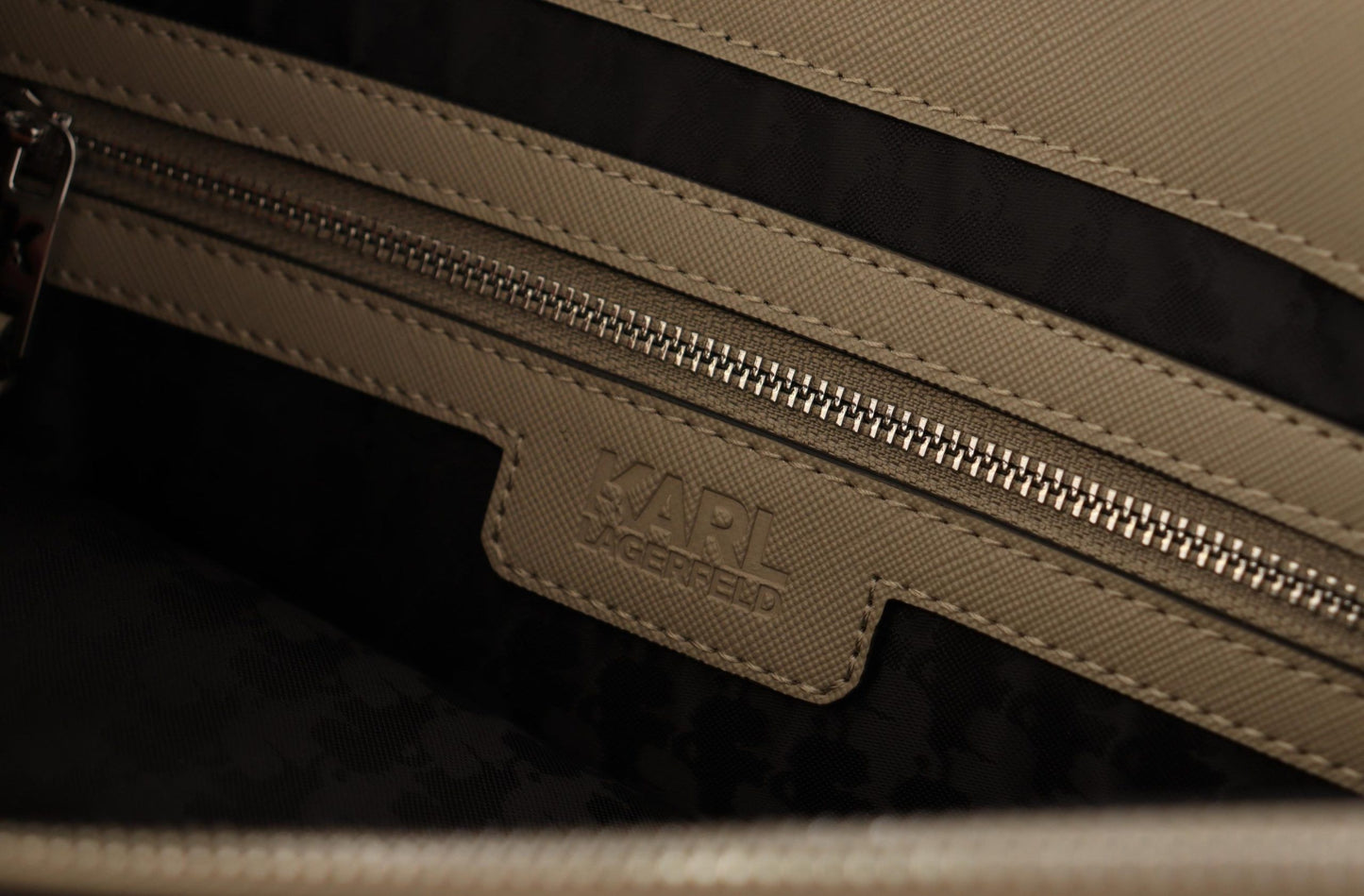 2-in-1 Shoulder & Crossbody Travel Tote Convertible Handbag by Karl Lagerfeld for women in polyurethane green & silver presents a exquisite silhouette, showcasing a secure zipper and organized built-in-compartments with versatile crossbody-strap, shoulder-strap & adjustable-strap.